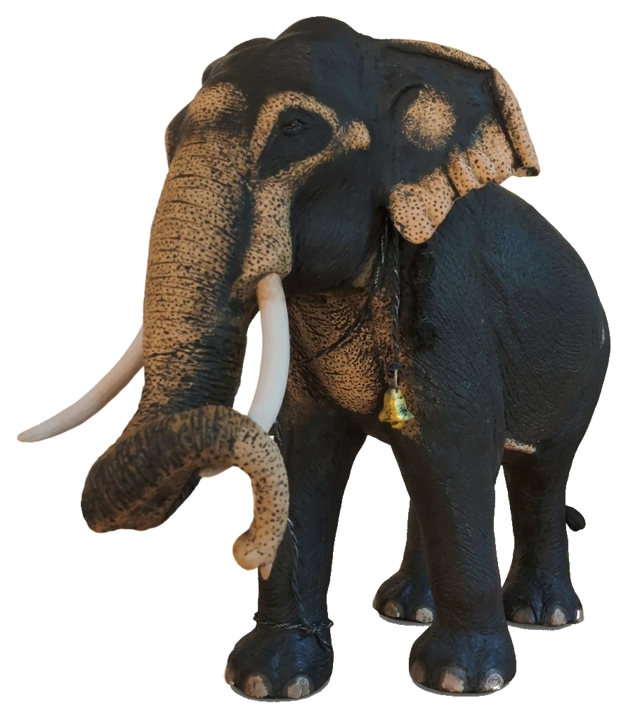 Kandula, a handmade Sri Lankan tusker sculpture with a curled trunk and pale freckled face and ears